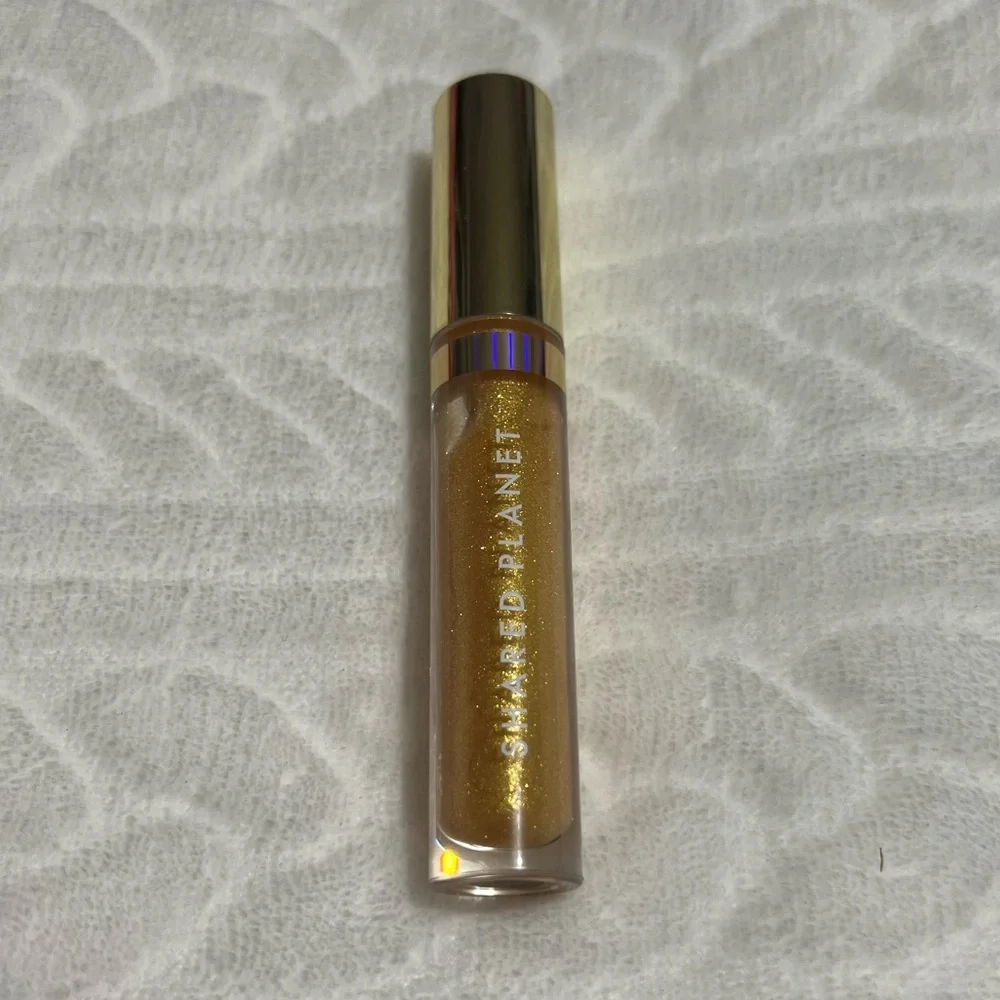 🖤 FREE 🖤‎ Shared Planet - Gold Lip Gloss